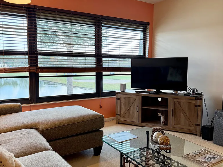 Cozy up and enjoy SPECTACULAR lake & golf course views from the living room!