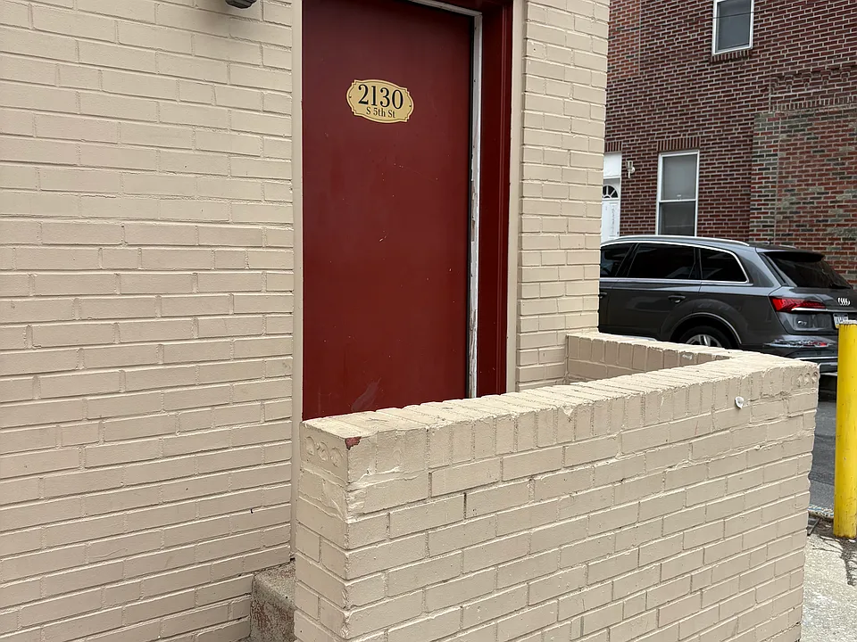 The front door with a small porch is a private entry to the 1st floor front apt ONLY.