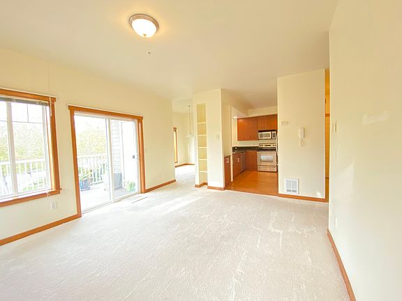 Living room looking into kitchen and dining room.