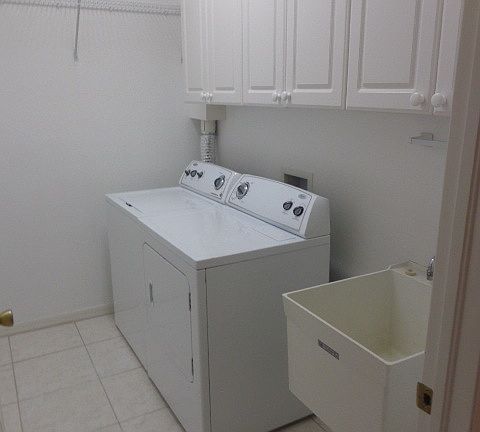 Inside laundry room with washer & dryer included