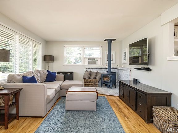 Open design, great room w/wood stove and hardwood flooring. Lots of windows for natural light!