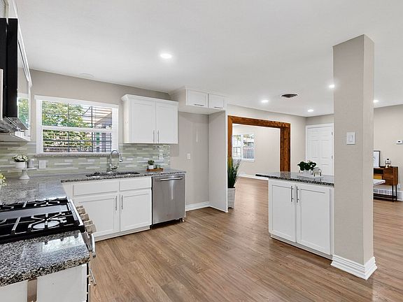 Tons of counter space, great flow, and open sight lines, this kitchen was made for real life. Great when you're meal prepping or hosting, everything just works here.