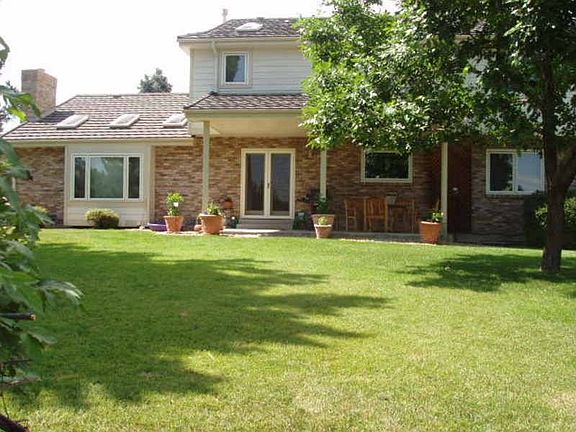 Back of Home with covered patio!