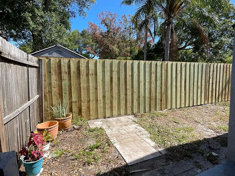 Private side yard off of carport