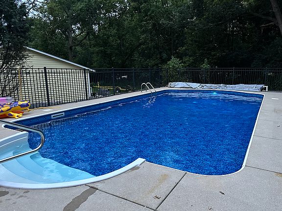 In ground pool with security fence