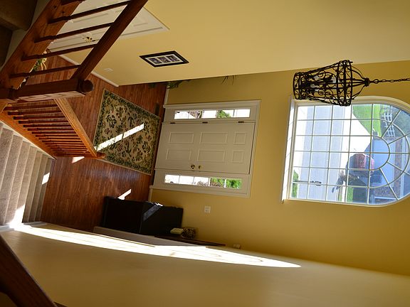Two-Story Foyer with Hardwood Flooring