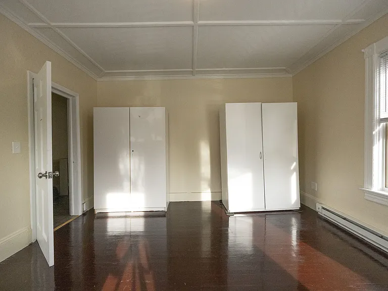 Third bedroom with freestanding wardrobe storage
