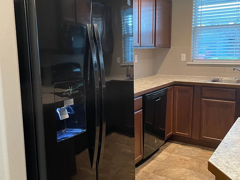 Kitchen View showing refrigerator + dishwasher