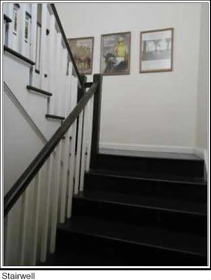 Stairwell leading to the 2nd Floor apartments.