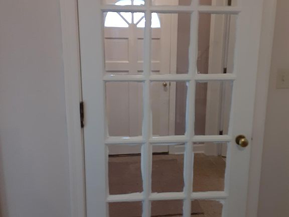 Attractive, welcoming foyer, terrazo floor, French door