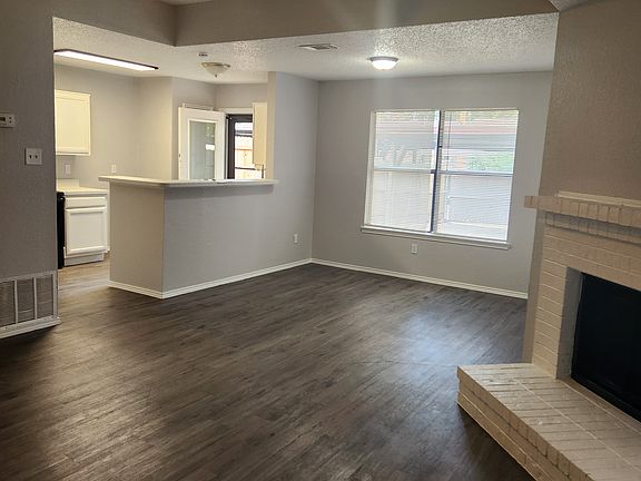 Living room facing toward the kitchen and dining room