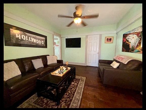 Open living room concept w/ 65 inch smart TV