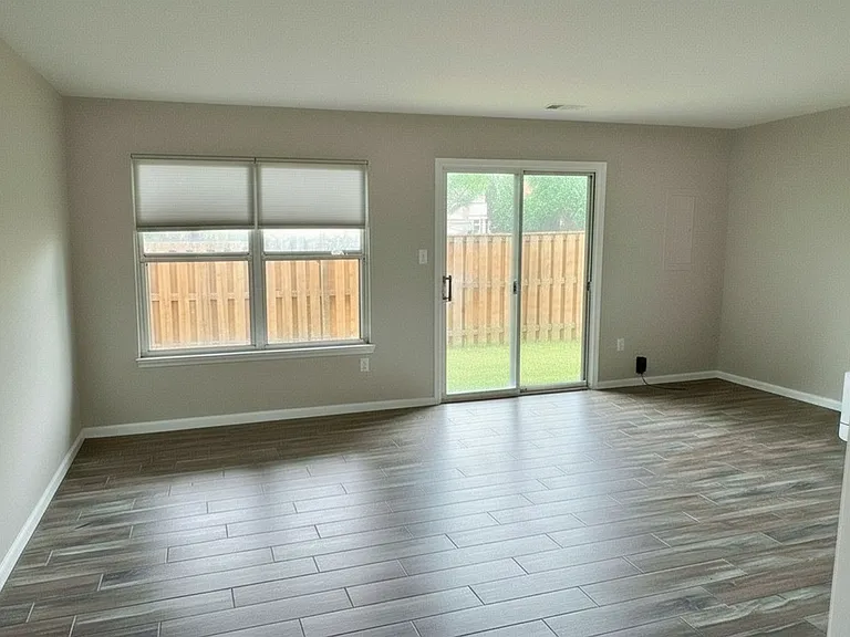 First floor (can be used as bedroom, office, playroom, or second living room) remodeled, full bathroom and brand new double sliding glass door leads to fenced in backyard