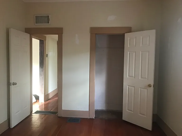 Front bedroom, closet, looking west with hallway