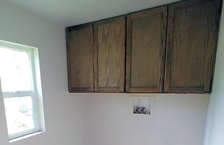 Laundry Room with cabinets.