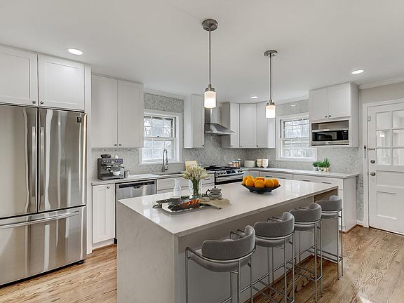 Large "waterfall style" island fully internet/ethernet connected. All quartz countertops.