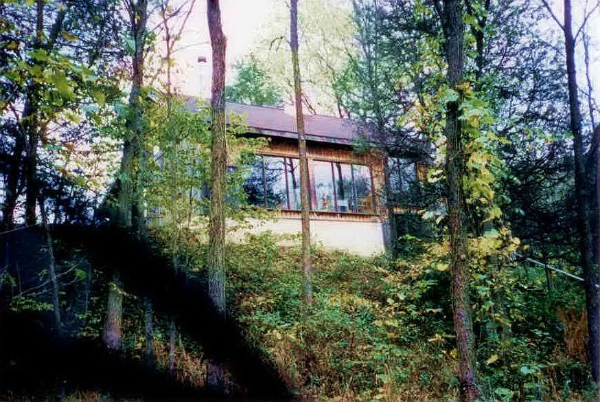 timber frame home overlooks stream