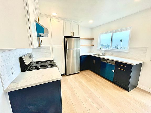 Fully remodeled kitchen w/ stainless steel appliances. Window looks out to the Pacific