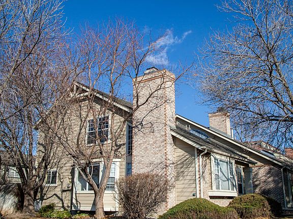 Southwest corner lot with lawn and shade trees. HOA does landscaping and lawn care.