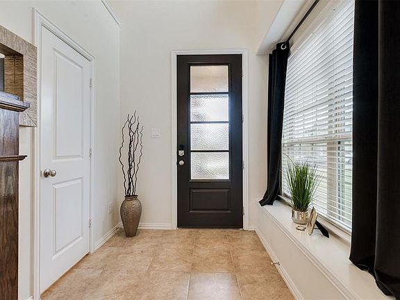 The stylish 8 Foot Insulated Fiberglass Door is an attractive focal point from the inside of the home as well. Note the attractive Window Seat that allows the welcoming Natural Light so prevalent throughout the home.