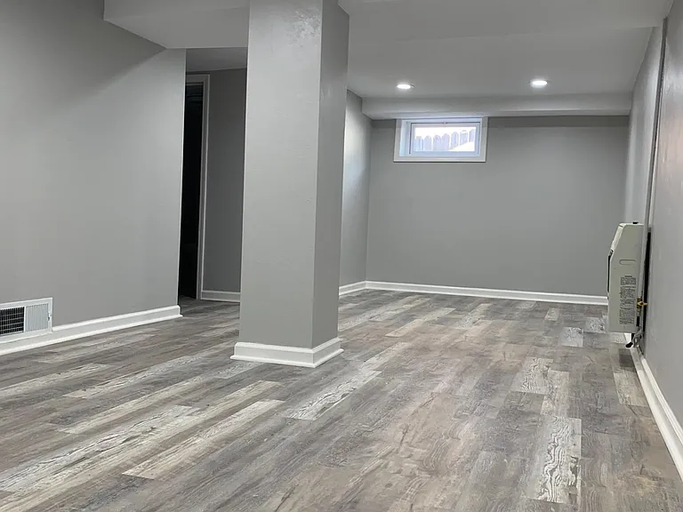 Basement with auxiliary gas wall heat