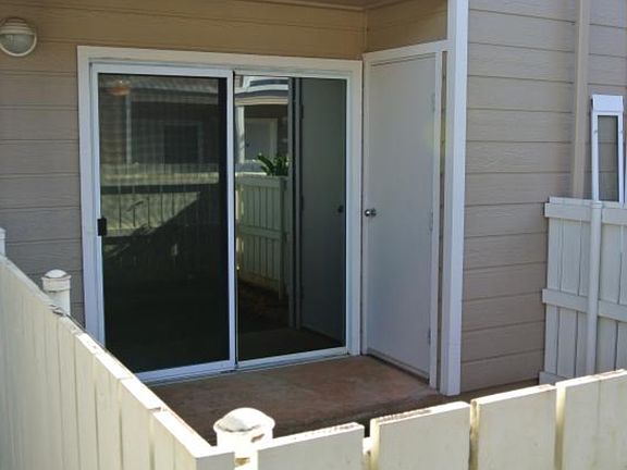 Patio includes storage closet and new fencing