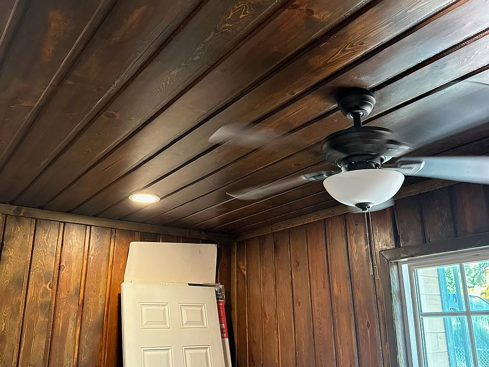 Bedroom with 1 closet and extra wood shelves for more clothes