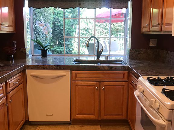 KITCHEN OVERLOOKS BACKYARD 