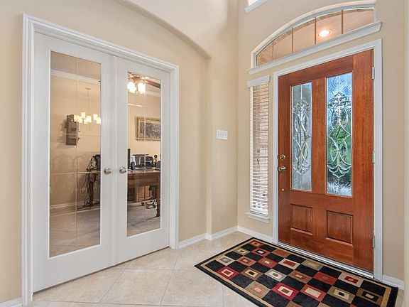 As soon as you enter the home, you will see the study located to your right enclosed with these beautiful french doors.