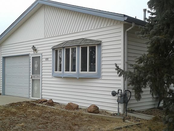 side with an additional 1-car garage