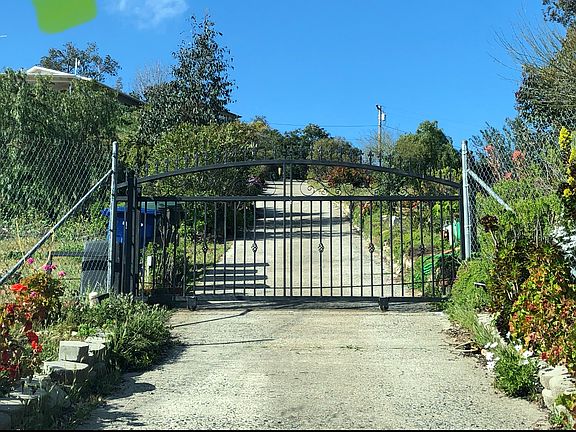 Driveway gate with remote or code access