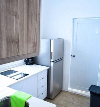 Kitchen and entrance to rooftop
