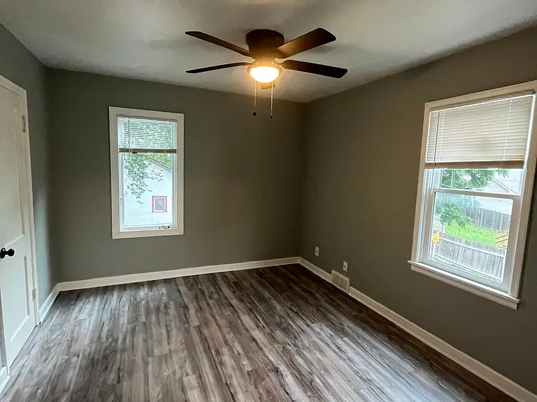 south bedroom;
vinyl plank flooring;
ceiling fans and decent sized closet