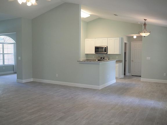 From the great room looking into the kitchen, breakfast area and the dining room.