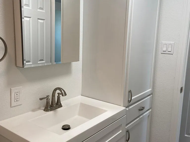 Lovely updated bath with linen storage