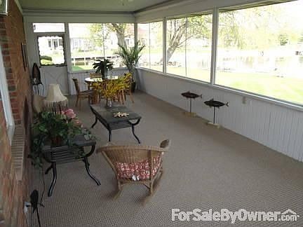 REAR PORCH : LOOKS OUT TO THE WATER