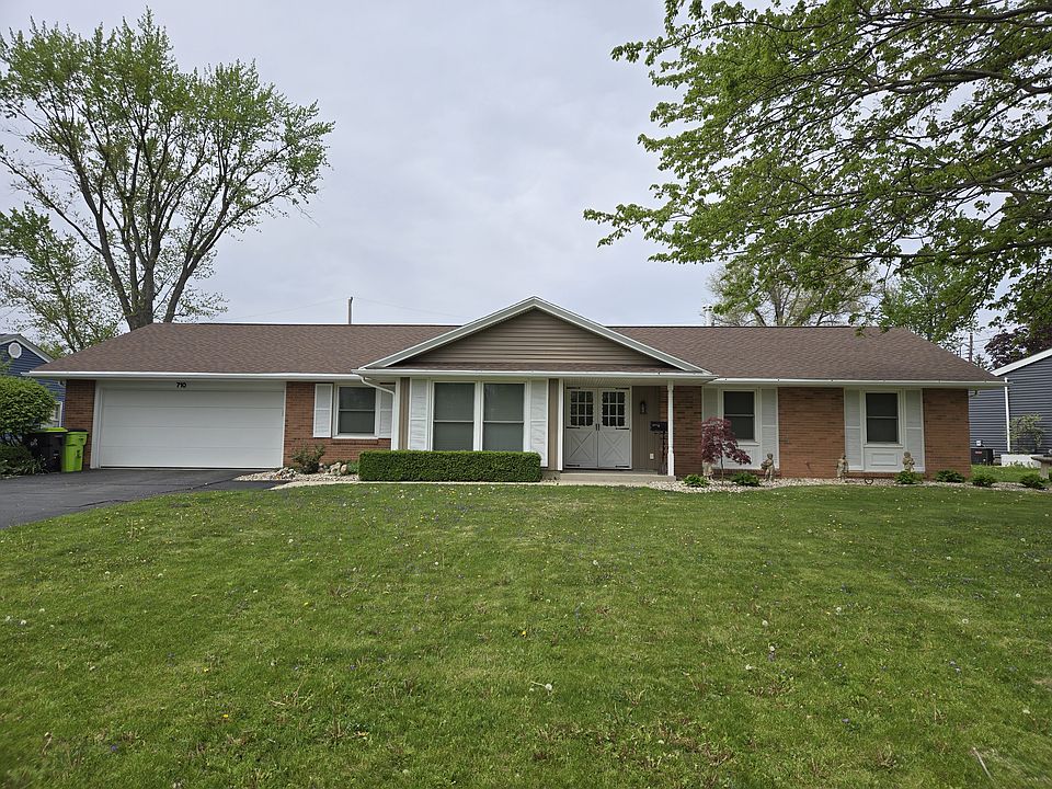 Front of house. 2 car garage.