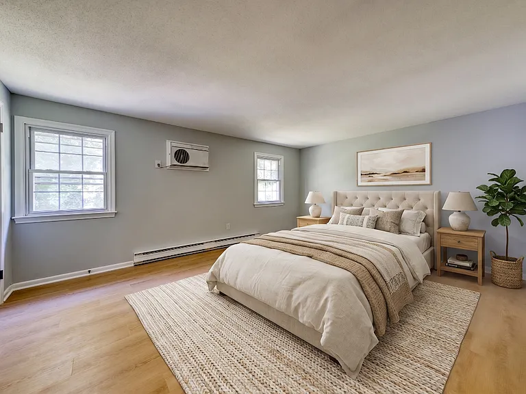 primary bedroom with plenty of closet space. virtually staged.