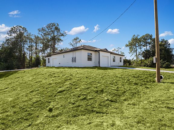 Positioned on a corner lot for complete privacy