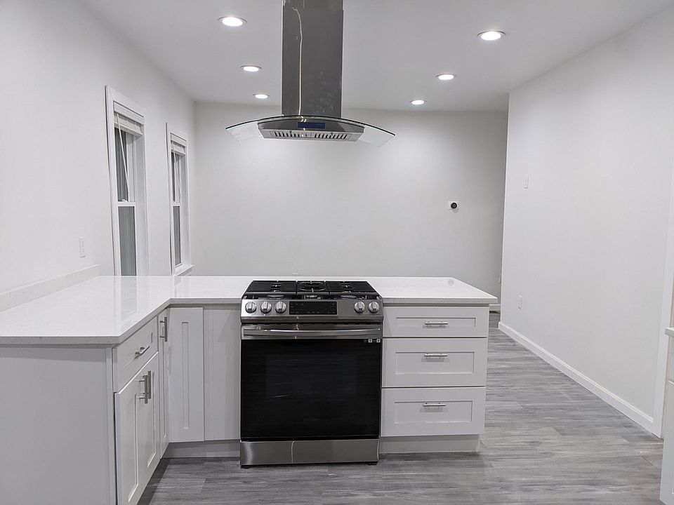 New Gas Range and Hood; Open concept Living room/Kitchen