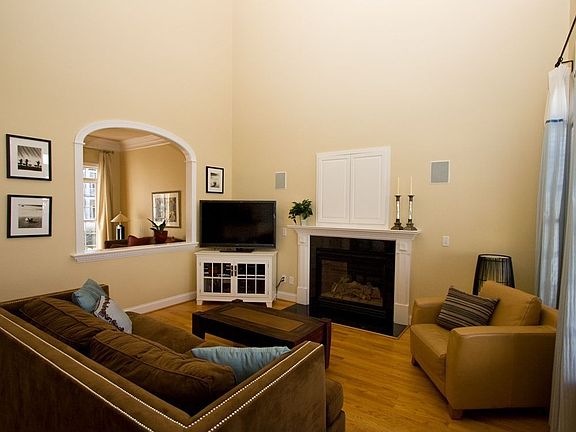 The 2 story family room flows into the kitchen.