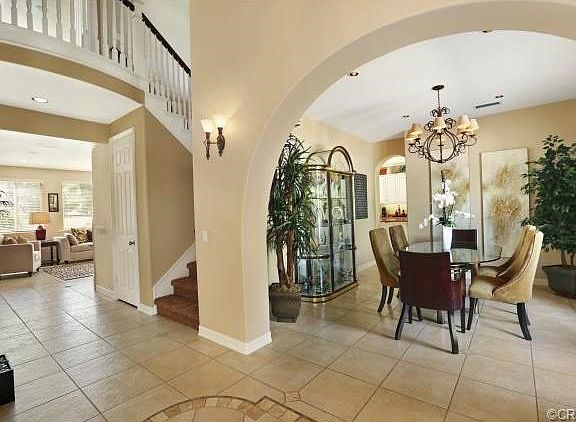 Formal Dining Room with Distinctive Arches and Italian Porcelain