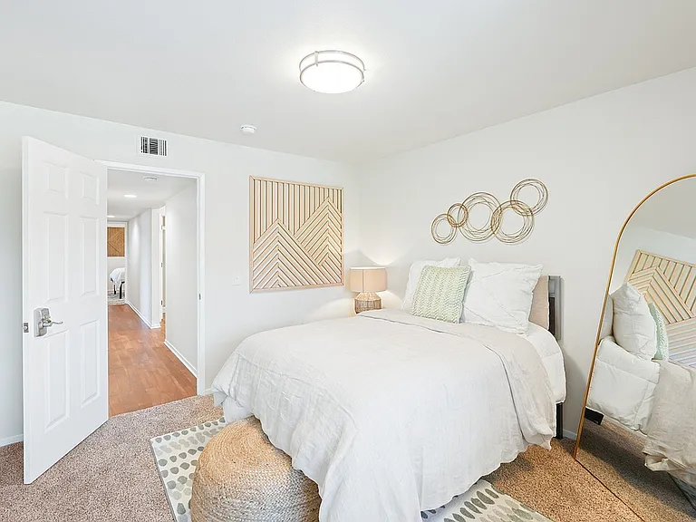 Experience comfort and style in this beautifully designed bedroom space.