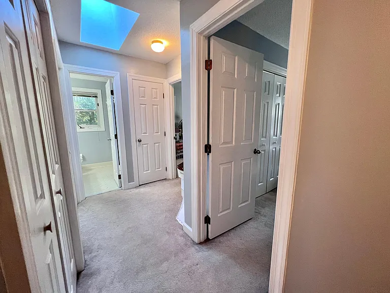 2nd Floor hallway w/Skylight and Closets