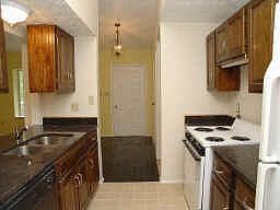 Updated kitchen with new appliances, granite counters and tile floor.