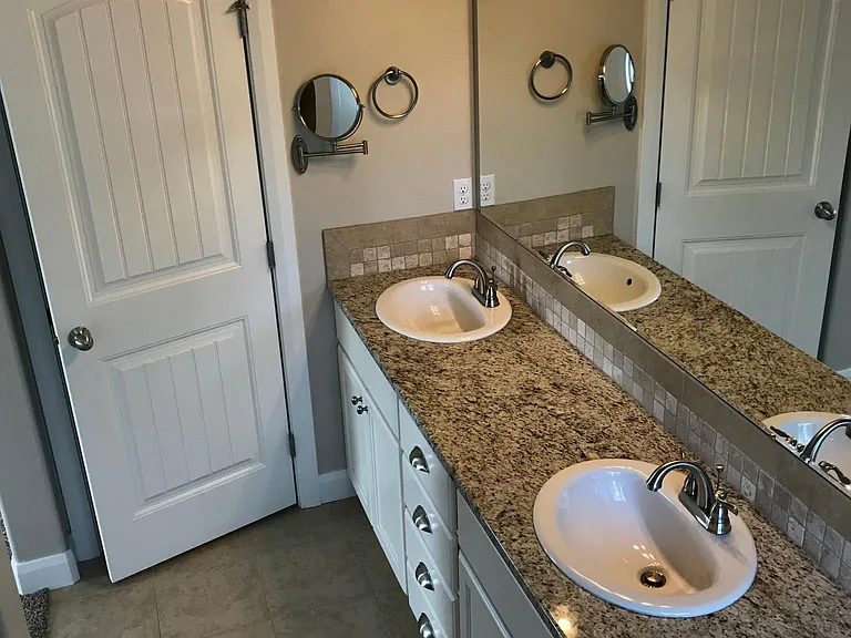 His and Her Sinks in Master