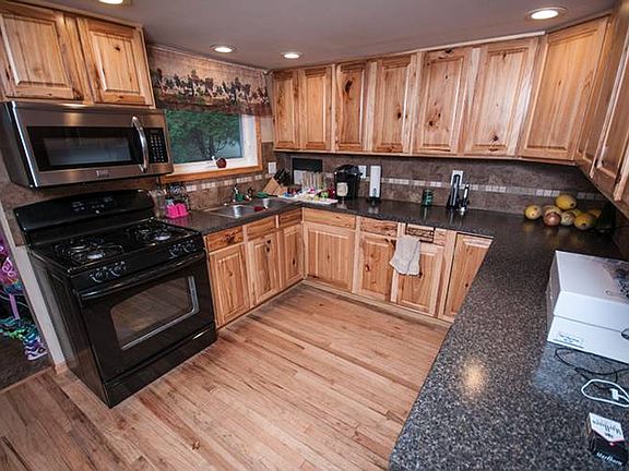 As you walk through the entry way in this great home, you enter the fully updated kitchen (10x12). With all new cabinets and counter tops, this kitchen was taken right down to the studs and completely redesigned!