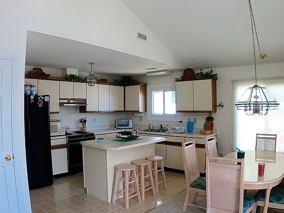 Kitchen, bar and dining area