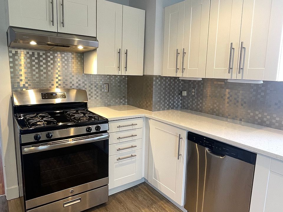 Modern kitchen with stainless appliances and granite countertops