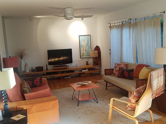 Sit down and relax. Open floor plan, original wood floors
